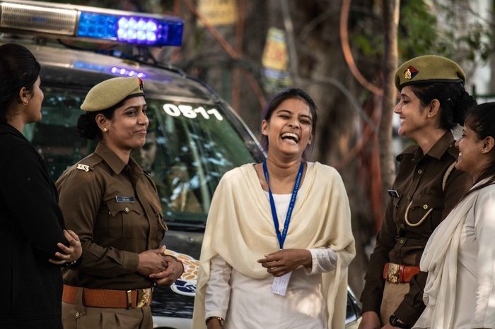 police-women-talking-to-a-happy-woman