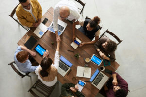 a-group-of-people-sitting-together-with-handshakes