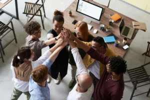 a-group-of-people-joining-hands-together-in-solidarity