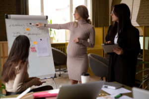 pregnant-woman-presenting-an-idea-in-the-office