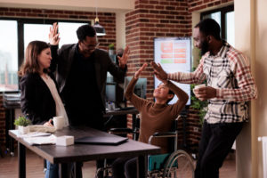 a-group-of-happy-people-in-the-office-discussing