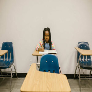 young-girl-sitting-alone