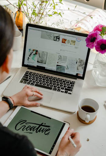 person-using-macbook-pro-on-table