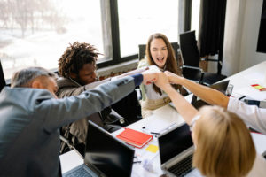 cheerful-workers-in-a-corporate-setup-smiling