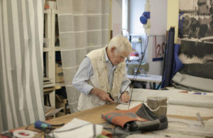 photo-of-man-cutting-using-scissors