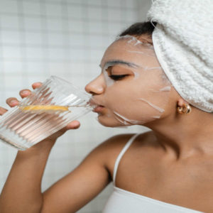 woman-doing-self-care-and-drinking-detoxifying-water