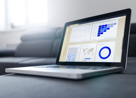 a-laptop-screen-with-graphics-of-tables-and-charts