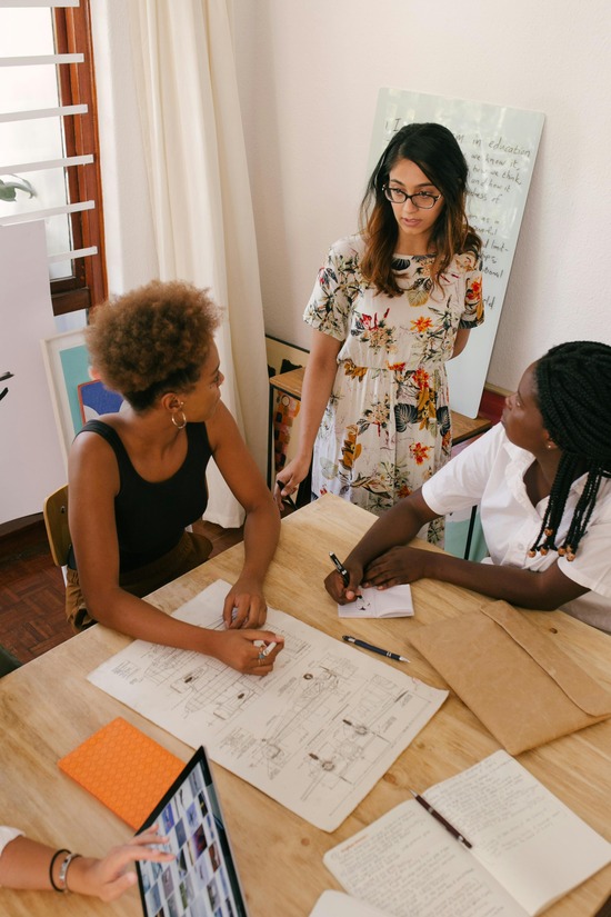 photo-of-women-having-a-meeting