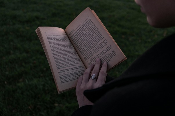 book-in-hand-of-woman