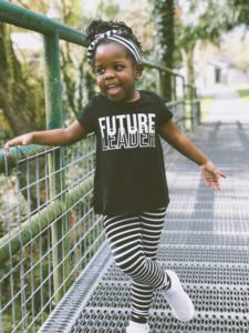 little-girl-enjoying-on-a-sunny-day-smiling