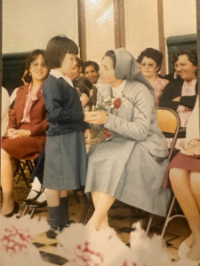 Melissa Velarde giving flower to a priest - Be a Diamond in a World of Coal