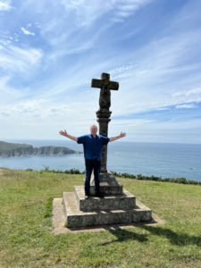 Toby standing Infront of a remote 14th century hermitage