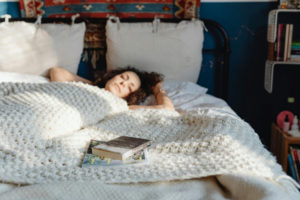 books-beside-a-sleeping-woman