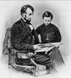 Abraham Lincoln reading the book