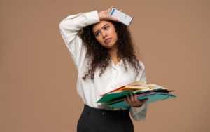woman-with-paper-work-confused