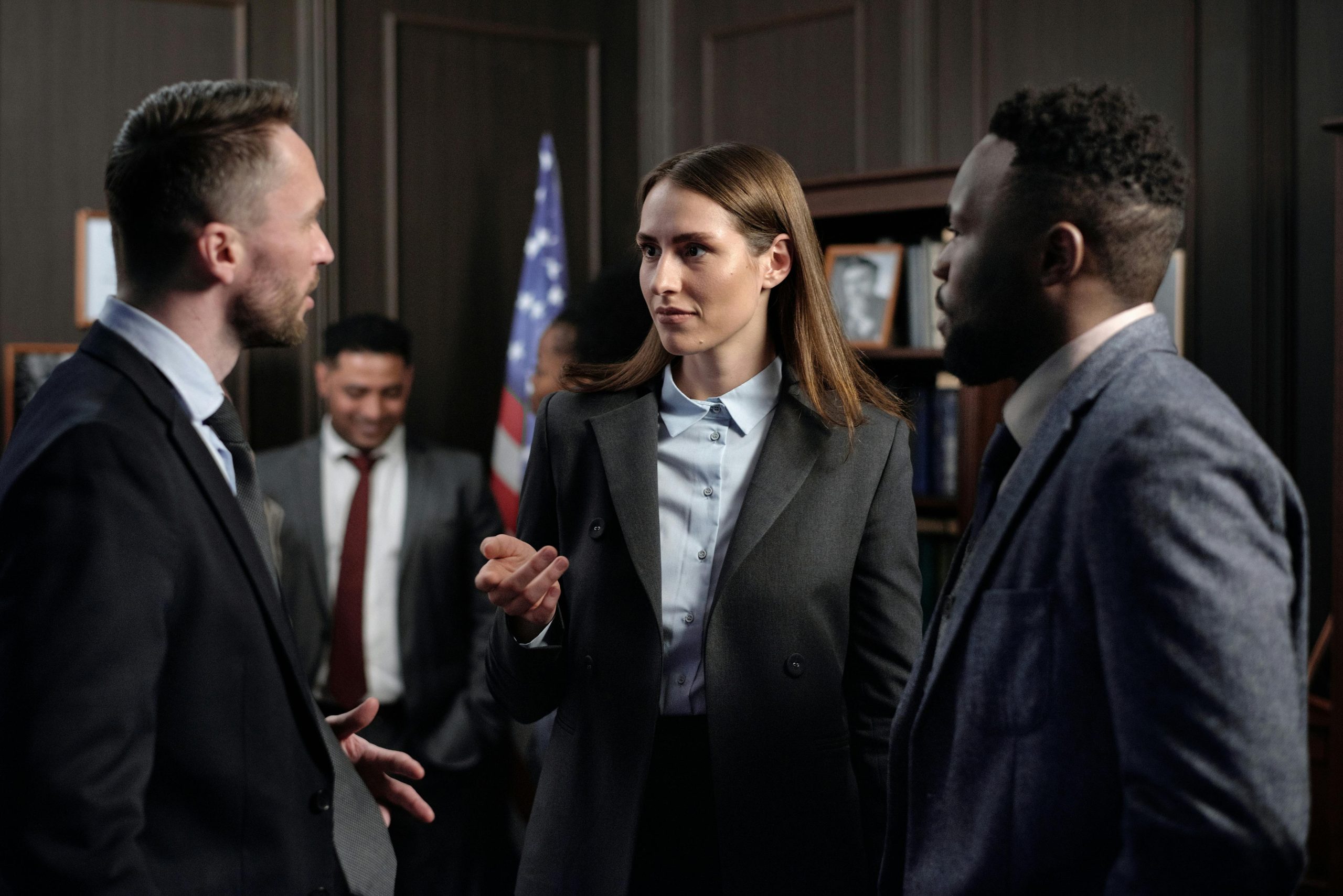 People in suits talking business strategies Business-people-Talking-inclusive-leadership