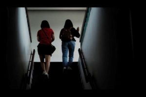 two-sisters-walking-one-slightly-behind