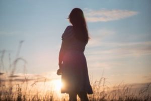 silhouette-of-a-woman-standing-in-sunlight
