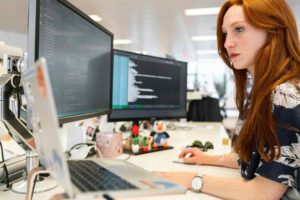 outsourcing-web-design-woman-working-with-codes-in-office