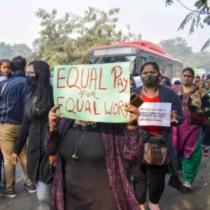 close-up-photo-of-a-woman-holding-a-placard