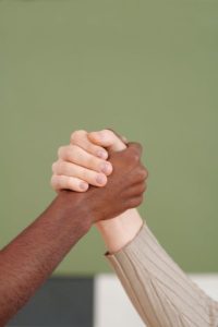 friends-with-hands-clasped-together