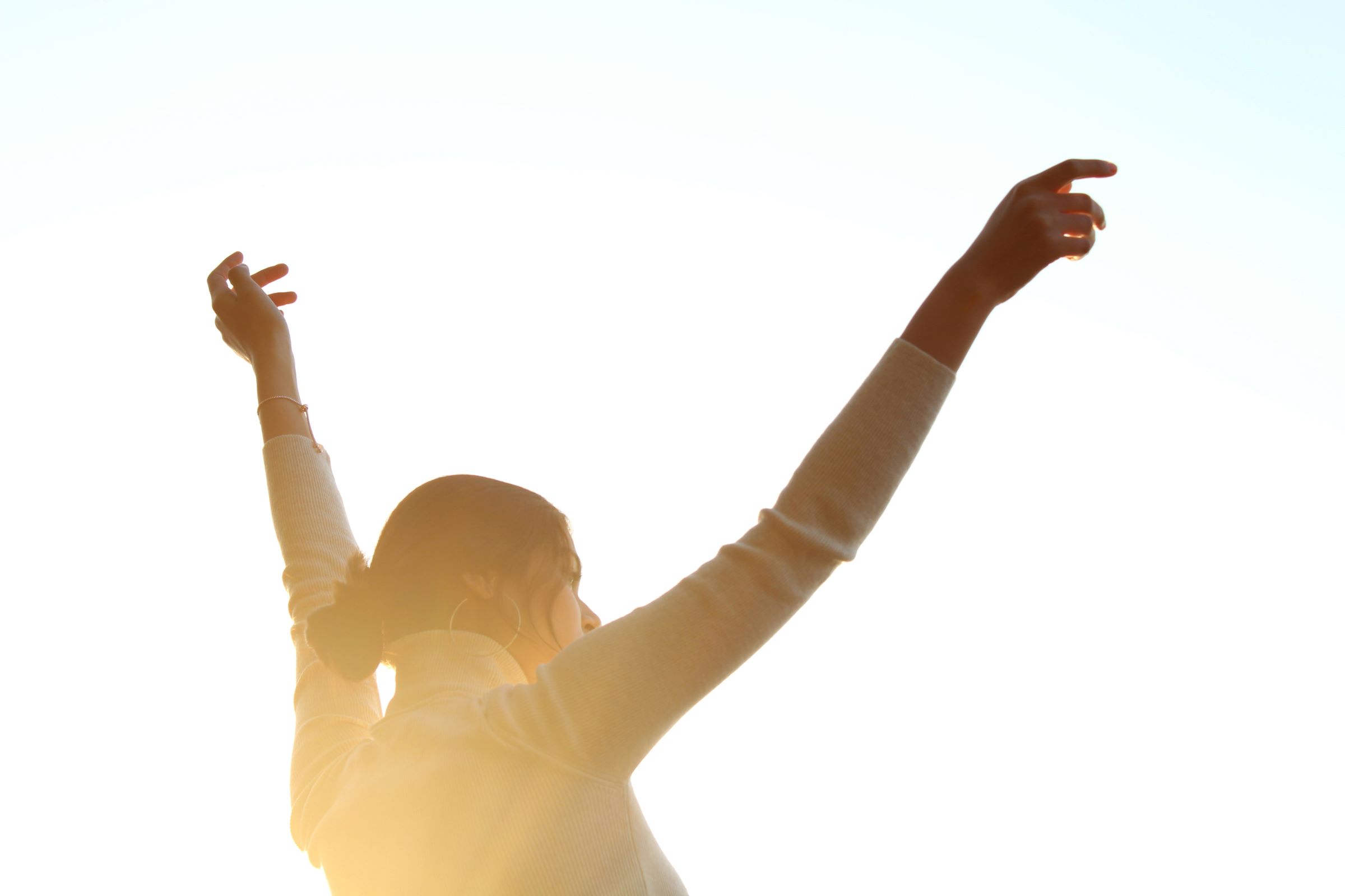 Woman raising her arms in the air