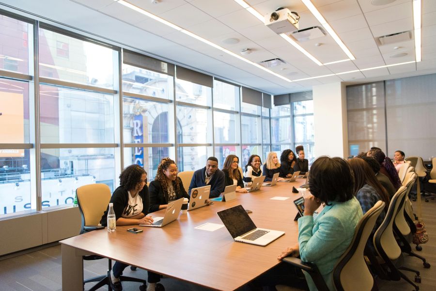 Group-of-confident-women-entrepreneurs-collaborating-on-laptops-in-a-bright-modern-workspace.
