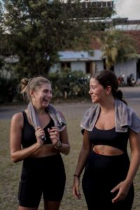two-women-enjoying-post-workout-relaxation-outdoors