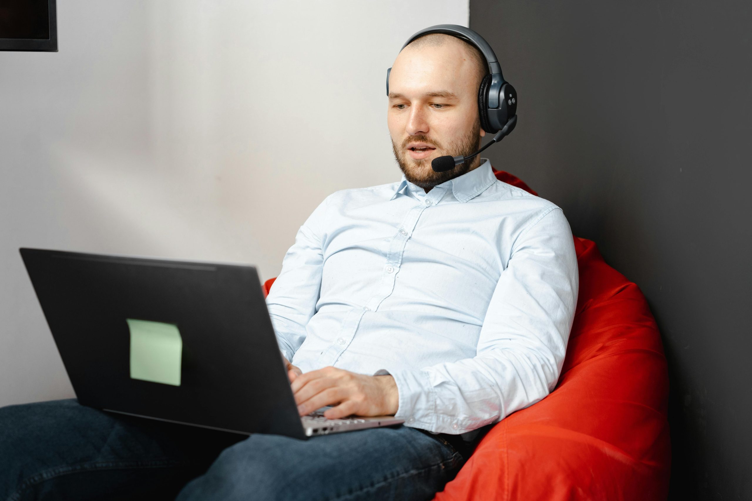 Man in Blue Long Sleeves Working in a Call Center.