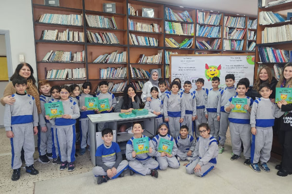 an-image-of-rhea-jabbour-in-a-library-with-a-bunch-of-children 