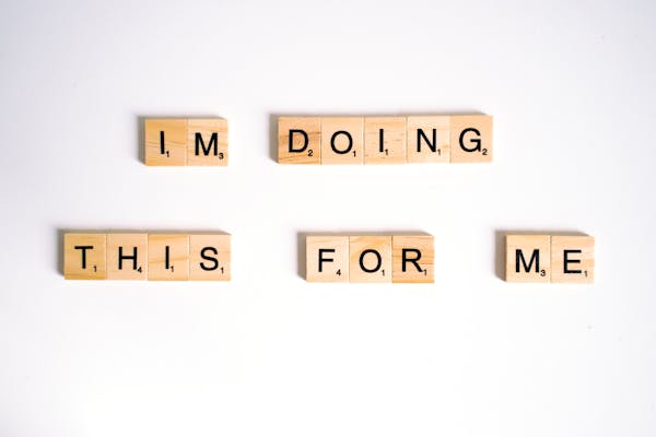 close-up-shot-of-scrabble-tiles-on-a-white-surface