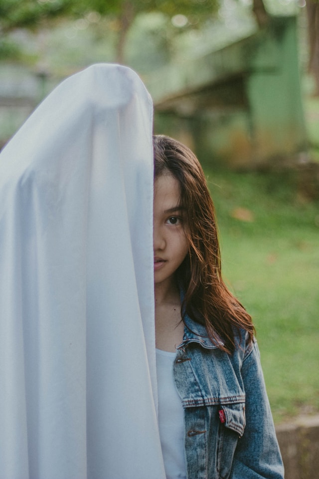 woman-covered-half-of-her-face-with-cloth