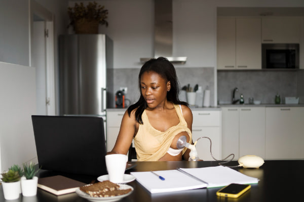 mother-preparing-breast-milk-child