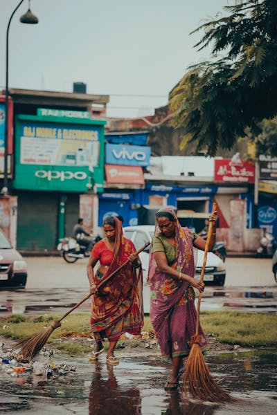 women-sweeping-the-street