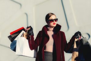 A confident woman shopping intentionally, symbolising the power of recognising marketing manipulation before making a purchase