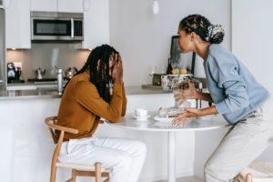 Two people having a disagreement, highlighting conflict resolution and relationship difficulties.