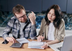 Couple reviewing household finances and financial plans together