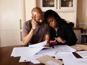 Couple discussing long-term financial and retirement plans at home