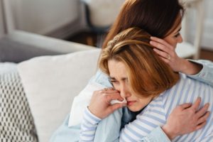 woman-hugging-her-friend