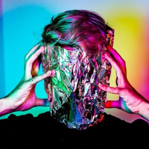 man-holding-a-foil-on-face-showing-anxiety-and-confusion
