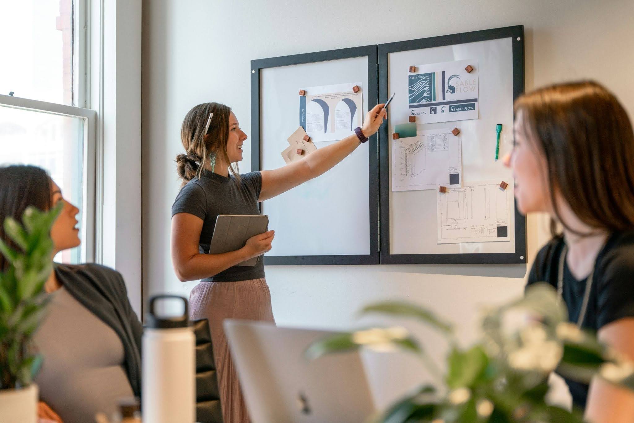 A professional woman walking through a corporate office, representing how women's leadership pipelines are quietly narrowing as DEI rollbacks reshape workplace structures.